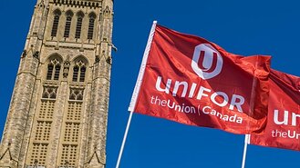 Parliament Hill with Unifor flags flying in front