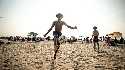 Visitors enjoying recreation activities at Wasaga Beach.