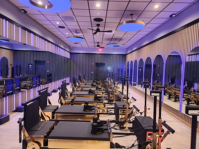 Pilates Addiction's Aurum™ Reformer with mood lighting. 