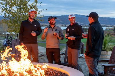 Friends enjoy drinks by the fireside after playing 18 holes of golf at Tamarack Resort's Osprey Meadows Golf Course.
