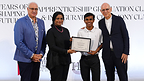 Ahmed Meesam Naeem receives his graduation certificate during the Class of 2026 ceremony