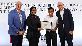 Ahmed Meesam Naeem receives his graduation certificate during the Class of 2026 ceremony