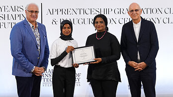 Fathimath Saraa receives her graduation certificate during the Class of 2026 ceremony
