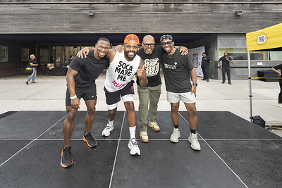 Group of male fitness instructors with the founder on the stage of The Black Man's Health Festival