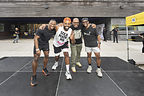 Group of male fitness instructors with the founder on the stage of The Black Man's Health Festival
