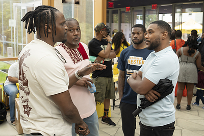 Group of Black men talking about their health.