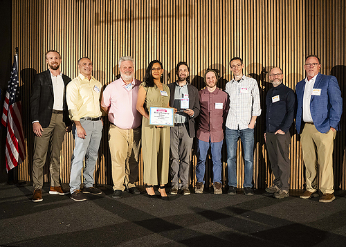 The BookBaby print production team accepting their award.