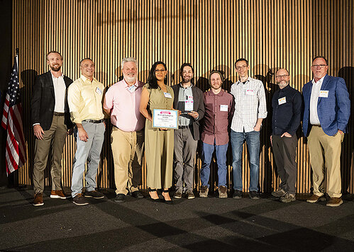 The BookBaby print production team accepting their award.