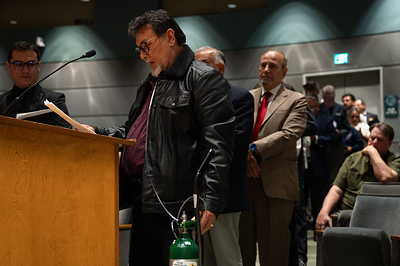 José Luis Mártir, a stone fabrication worker diagnosed with silicosis, testifies at a meeting of the Occupational Safety and Health Standards Board. Photo by Semantha Raquel Norris.