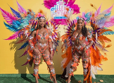 Masqueraders pose at the Antigua Carnival Pop-up to celebrate this summers carnival season