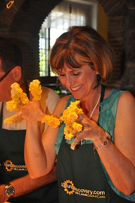 Culture Discovery Vacations guests cooking with a local family in Soriano nel Cimino, Italy