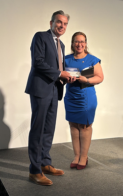David Healy, president of Sun Life U.S., receives HELP Hero award from HELP USA, presented by NYC Deputy Mayor for Health and Human Services, Dr. Helen Arteaga Landaverde.