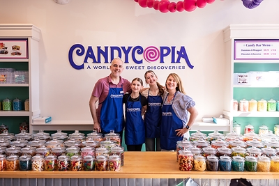 MAKING SOUR CANDY HISTORY: Candycopia owners Patrick and Alycia Mason, with their daughters, are preparing for an historic summer. The local candy destination has invited hundreds of sour candy enthusiasts to gather on July 18 in Oak Park to help set a GUINNESS WORLD RECORDS™ title for the Largest Sour Candy Tasting. Photo Credit: Little Bitty Productions MAKING SOUR CANDY HISTORY: Candycopia owners Patrick and Alycia Mason, with their daughters, are preparing for an historic summer. The local candy destination has invited hundreds of sour candy enthusiasts to gather on July 18 in Oak Park to help set a GUINNESS WORLD RECORDS™ title for the Largest Sour Candy Tasting. Photo Credit: Little Bitty Productions