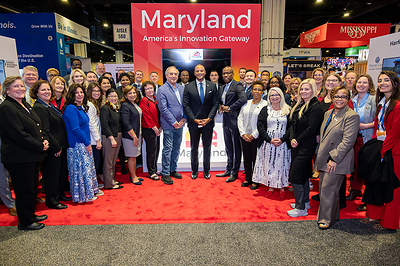 Maryland Governor Wes Moore, Montgomery County Executive Marc Elrich, and Maryland representatives at the Team Maryland booth during the 2026 SelectUSA Investment. Photo courtesy of the Maryland Governor’s Office.