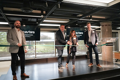 Lori and Jeff Cavanagh cut the ribbon during the grand opening of Cavtera’s new office, joined by Ryan Quesnel (left) and Joe Patrois (right) as the company celebrated the milestone event.