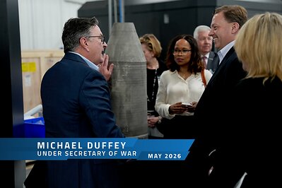 Titomic CEO & Managing Director Jim Simpson showcases a large-scale warhead component to Under Secretary of Defense Michael Duffey during a visit to Titomic USA, May 2026. This image opens in the lightbox