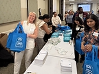 Leah McInerney and forum attendees pack 300 Asthma & Allergy Friendly® Resource Tote Bags for distribution across Chicago communities, May 21, 2026.