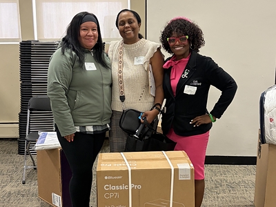Rachelle Paul-Brutus, Executive Director of the Chicago Asthma Consortium, with Certified partner product donations at the 2026 CHW Educational Forum, Chicago, May 21, 2026.