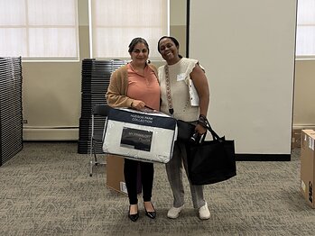 Rachelle Paul-Brutus, Executive Director of the Chicago Asthma Consortium, with Certified partner product donations at the 2026 CHW Educational Forum, Chicago, May 21, 2026.