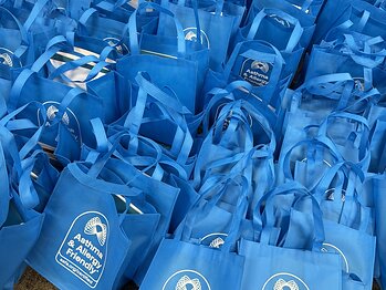 300 Asthma & Allergy Friendly® Resource Tote Bags, packed with educational materials and Certified partner contributions for distribution across Chicago communities, May 2026.