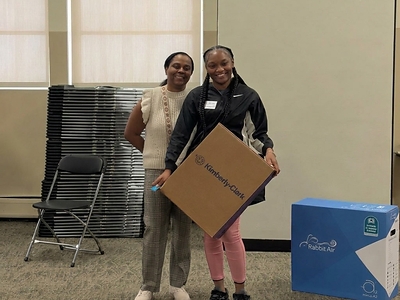 Rachelle Paul-Brutus, Executive Director of the Chicago Asthma Consortium, with a Kimberly-Clark/Kleenex® product donation at the 2026 CHW Educational Forum, Chicago, May 21, 2026.