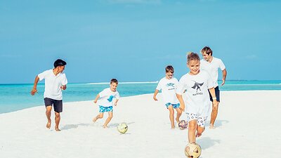 At Four Seasons Resort Maldives at Landaa Giraavaru, the game takes on an island rhythm with football legends