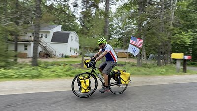 Retired Vice Adm. Manson K. Brown rides into Bar Harbor, Maine, on June 11, 2026, completing a solo, unsupported bicycle journey from Key West, Florida, to raise awareness and support for Coast Guard families through Coast Guard Mutual Assistance. Photo courtesy of Coast Guard Mutual Assistance.