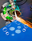 LASER DEBRIS SHIELDS RESIST SPATTER AND PITTING
