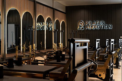 Pilates Addiction studio featuring a thoughtfully built-out space, sleek reformers, and a high-energy class environment. Pilates Addiction studio featuring a thoughtfully built-out space, sleek reformers, and a high-energy class environment.