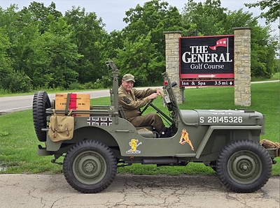 A World War II reenactor arrives in a restored military Jeep at Eagle Ridge Resort & Spa during the resort's Fourth of July celebration benefiting Honor Flight of Dubuque and the Tri-States. The event features immersive living history experiences, patriotic tributes, and family-friendly activities honoring America's veterans. Photo Credit: Eagle Ridge Resort & Spa.
