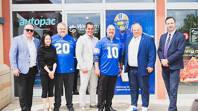 Guests including (from L to R): Western Financial Group’s Craig Kozlowski, Chief Information and Technology Officer; Michelle Mak, Director, Western Communities Foundation; Darren Sinclair, Senior Vice President, National Branch Network; Grant Ostir, Chief Executive Officer; Mike Chapnick, Vice President, Provincial Branch Network; Winnipeg Blue Bombers’ President and CEO Wade Miller; and Manitoba Finance Minister Adrien Sala take part in Western’s tailgate-themed community event.