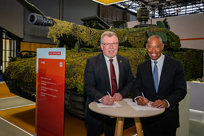 Tommy Gustafsson-Rask, President at BAE Systems Hägglunds, and Dana Pittard, Vice President of Defense Programs at Allison Transmission, sign the agreement at Eurosatory.