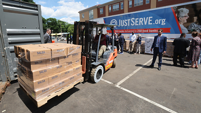 A semitruck carrying more than 37,000 pounds of food from The Church of Jesus Christ of Latter-day Saints is delivered to Catholic Charities Boston Yawkey Center in Boston, Massachusetts, on Wednesday, June 17, 2026, as part of America250's nationwide "America Gives" initiative.