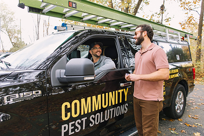 Community Pest Solutions Technician Consulting with Ann Arbor Home Owner Community Pest Solutions Technician Consulting with Ann Arbor Home Owner