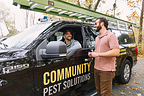 Community Pest Solutions Technician Consulting with Ann Arbor Home Owner