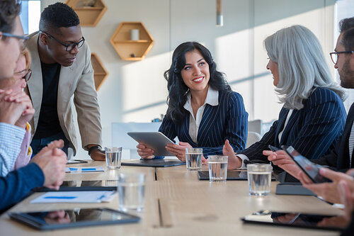 Group of business men and women collaborating and working together. 