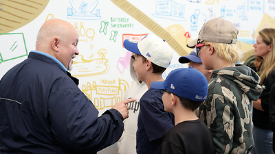 Mayor Brian Smith talking with a Grade 6 student whose 