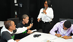 GDLU youth passing the mic after speaking and writing lyrics.