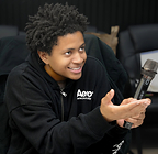 GDLU youth smiling and having a "mic drop" moment.