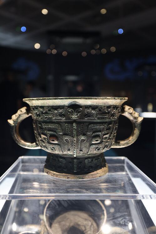 A bronze gui  vessel with taotie motifs, reflecting the sophisticated bronze-casting techniques  of the Shang Dynasty (c. 16th century-11th century BC).