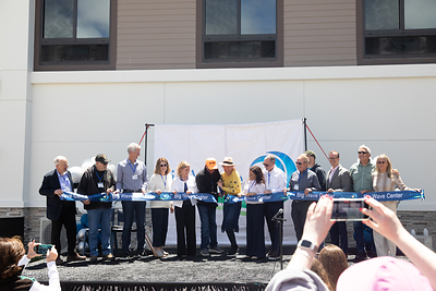 Big Wave Group's Board of Directors celebrates the opening of the Big Wave Center with California Assemblymember Marc Berman, members of the Peck and Barber families, who donated the land for the project, and one of the Center's first residents during the June 27 ribbon-cutting ceremony in Half Moon Bay. The Big Wave Center provides housing and opportunities for adults with intellectual and developmental disabilities throughout San Mateo County. Photo courtesy of Shanti Minkstein/Big Wave Group