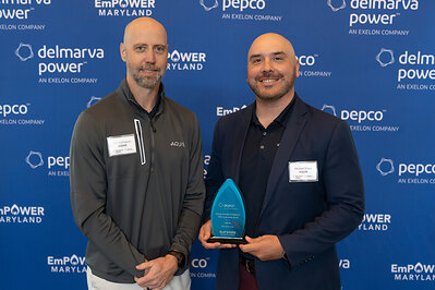 Dan McFadyen (L) and Michael Estes (R) of AQUIS receive the Pepco Dan McFadyen (L) and Michael Estes (R) of AQUIS receive the Pepco