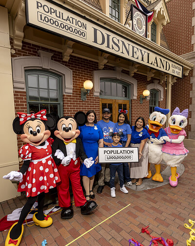 Disneyland Resort Celebrates Historic Milestone – One Billionth Guest: A milestone at Disneyland Resort in Anaheim, Calif., on Friday, July 3, 2026; The Happiest Place on Earth commemorates welcoming one billion guests to Disneyland park and Disney California Adventure park. The honorary one billionth guest, Andres Robles, 8, of Arizona and his parents joined with the Disney Ambassadors to unveil updated sign that reads “Population 1,000,000,000”. (ChristianThompson/Disneyland Resort)