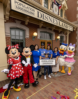 Disneyland Resort Celebrates Historic Milestone – One Billionth Guest: A milestone at Disneyland Resort in Anaheim, Calif., on Friday, July 3, 2026; The Happiest Place on Earth commemorates welcoming one billion guests to Disneyland park and Disney California Adventure park. The honorary one billionth guest, Andres Robles, 8, of Arizona and his parents joined with the Disney Ambassadors to unveil updated sign that reads “Population 1,000,000,000”. (ChristianThompson/Disneyland Resort)