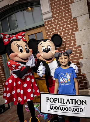 Disneyland Resort Celebrates Historic Milestone – One Billionth Guest : A milestone is made at Disneyland Resort in Anaheim, Calif., on Friday, July 3, 2026; commemorating one billion guests at Disneyland park and Disney California Adventure park. The honorary one billionth guest, Andres Robles, 8, of Arizona unveiled an updated sign that reads "Population 1,000,000,000". (Christian Thompson/Disneyland Resort)
