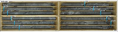 Figure 4. Drill core boxes from drillhole QVD-466 displaying a representative portion of the interval from 139.0 to 150.0 meters, which returned a broad intercept of 0.44 g/t Au over 11.0 meters. This new gold-mineralized zone north of Yaxtché East suggests a potential link between the main deposit and the Carmen target, which is known for its gold-copper mineralization. Figure 4. Drill core boxes from drillhole QVD-466 displaying a representative portion of the interval from 139.0 to 150.0 meters, which returned a broad intercept of 0.44 g/t Au over 11.0 meters. This new gold-mineralized zone north of Yaxtché East suggests a potential link between the main deposit and the Carmen target, which is known for its gold-copper mineralization.