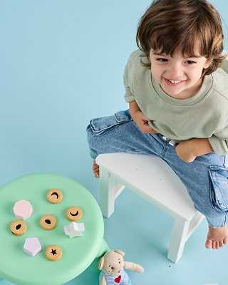 Toddler snacking on Little Bellies organic snacks.