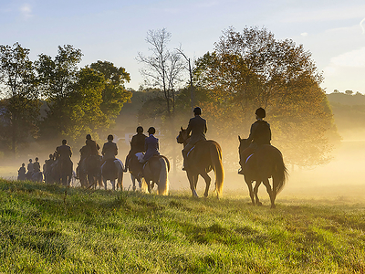 This image, taken by the property owner, shows a pack of riders ready to begin a traditional fox hunt as the sun rises over Hallmark Farm. The property owner is a veteran equestrian who has hosted many classic fox hunts on the property, which still includes a dedicated hunter trial course with built-in obstacles, in addition to a series of clay-shooting stations. HudsonValleyLuxuryAuction.com.