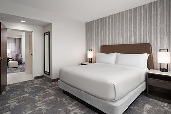 Renovated king suite at Embassy Suites Charlotte Concord features contemporary furnishings, modern finishes and enhanced comfort.