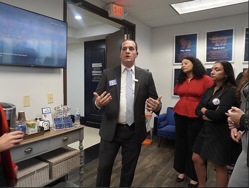 David Fry Speaking to Attendees at Rossen Law Firm Office